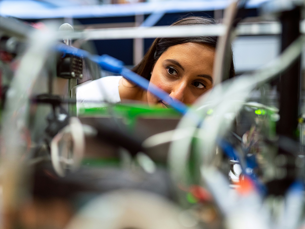 Engineer inspecting equipment rack